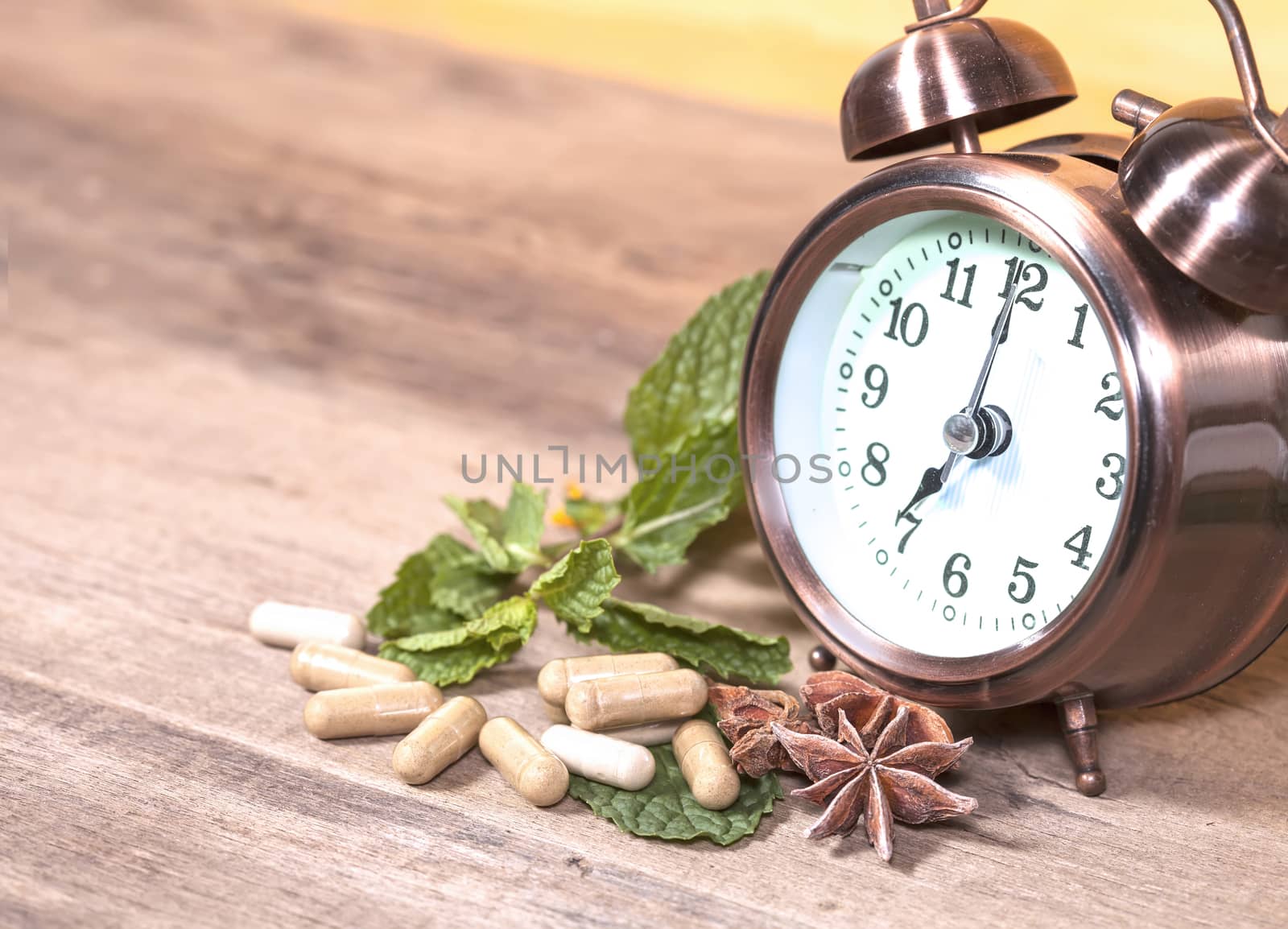 Time to eat Organic Herb capsule medicine with mint leaves