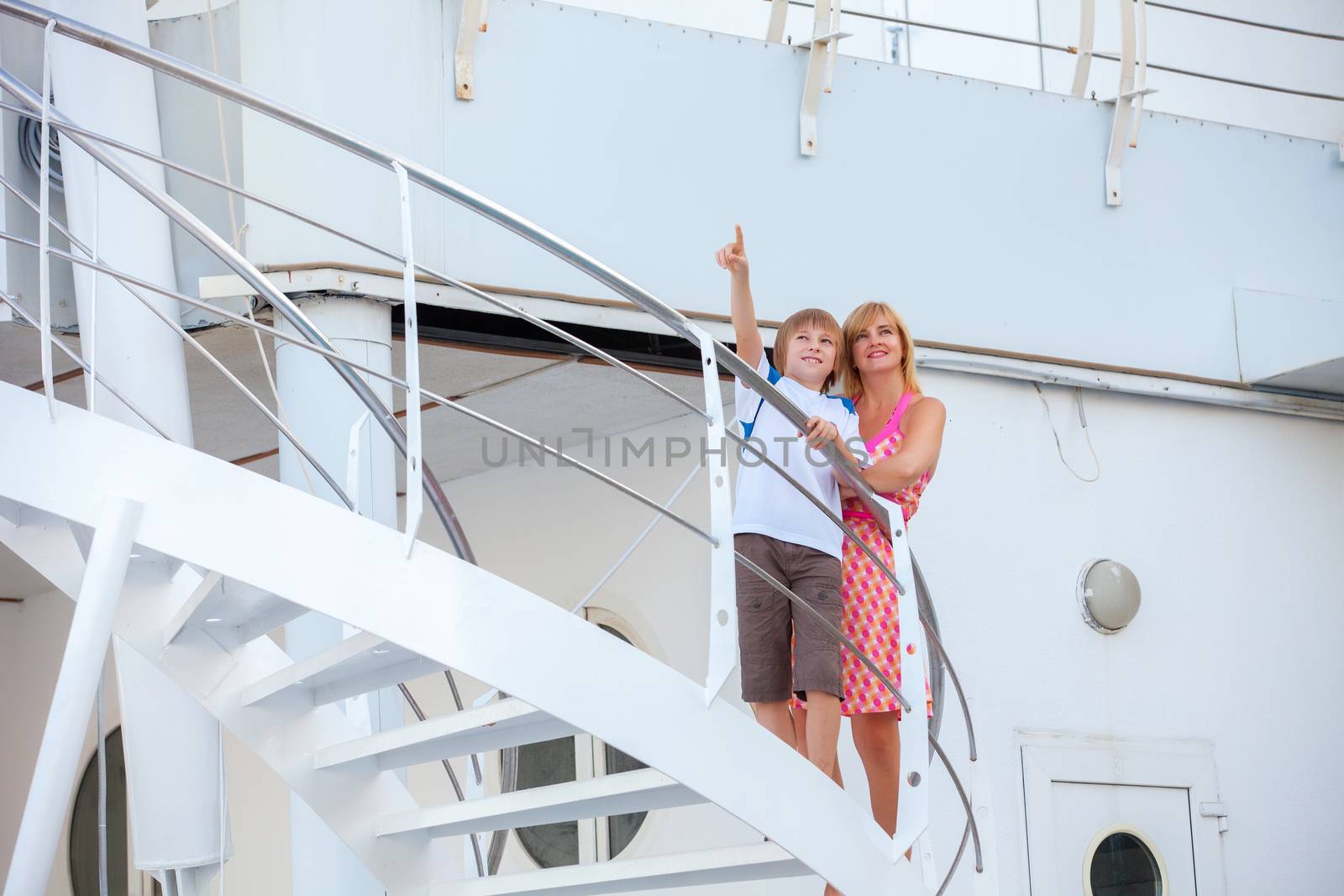 Happy mother with son travel on cruise ship