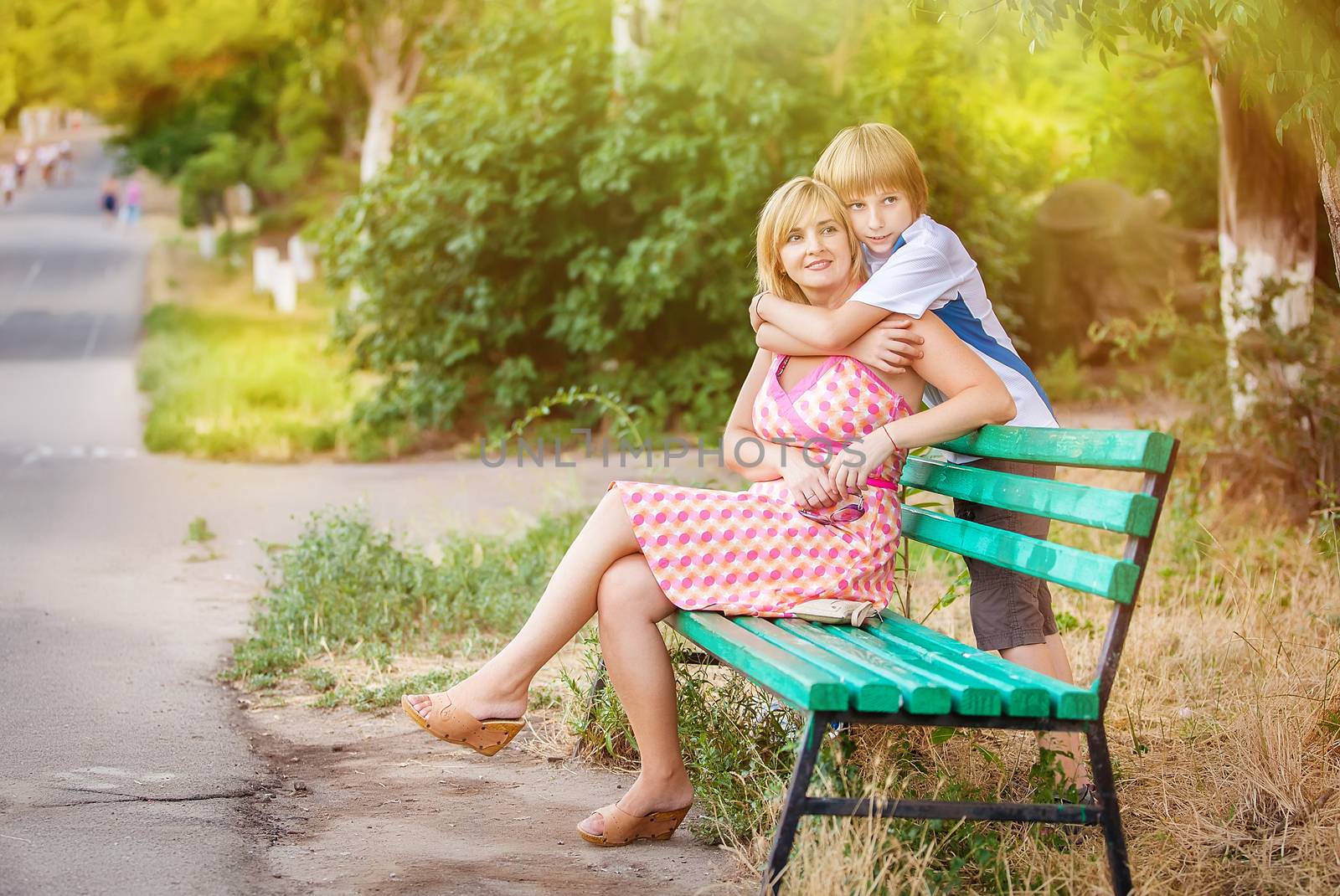 happy mother and son in park