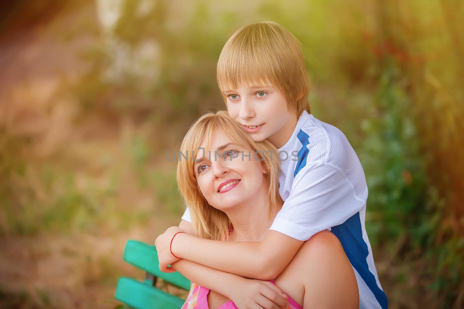 happy mother and son in park