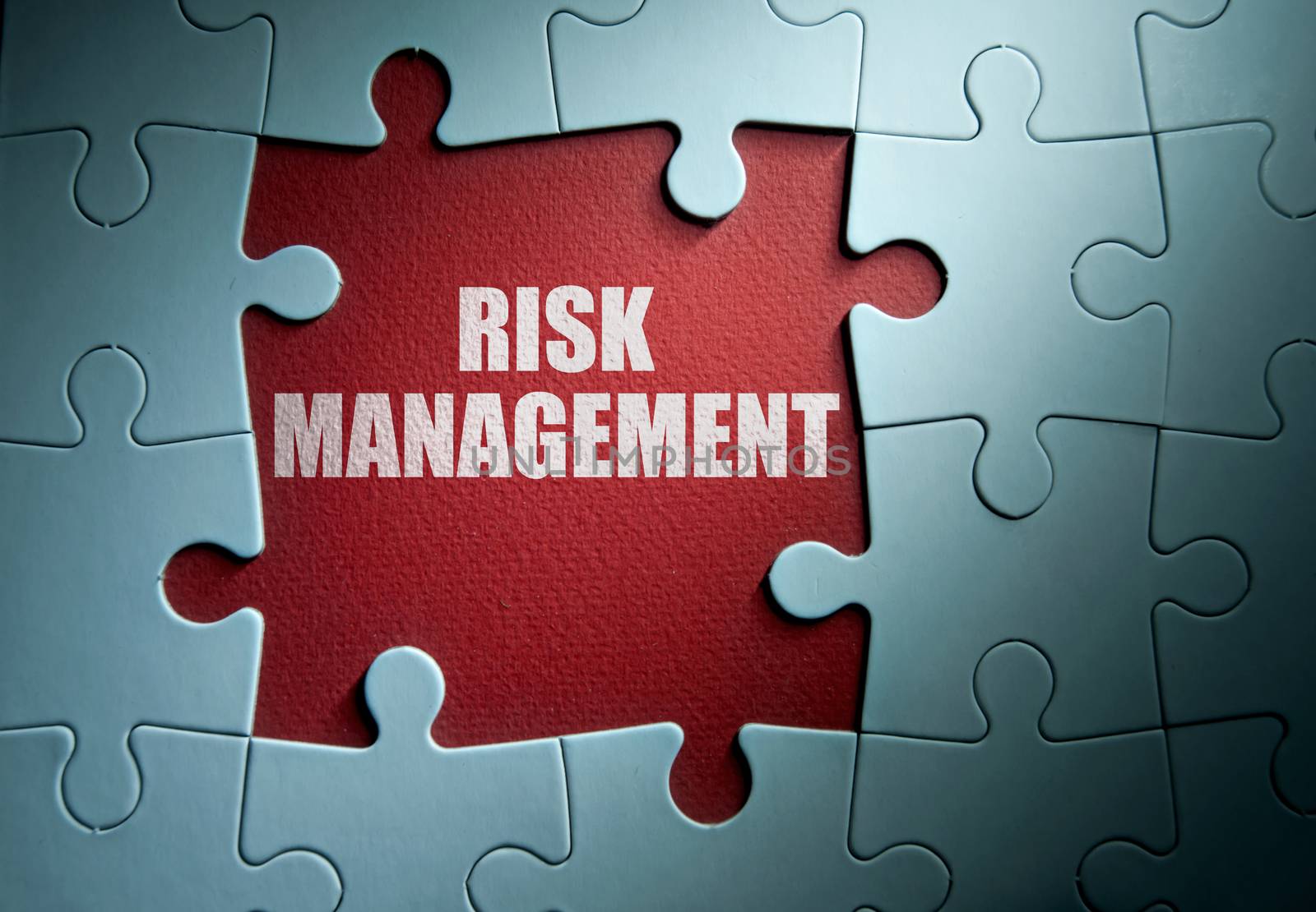 Missing pieces from a jigsaw puzzle revealing risk management