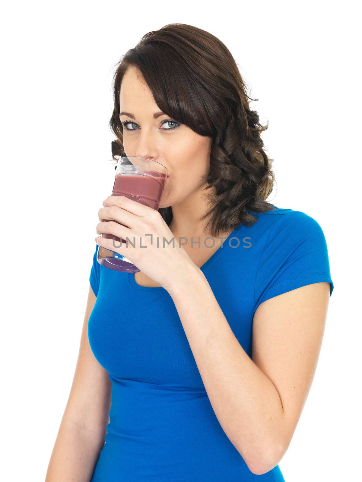 Attractive Young Woman Drinking a Fruit Smoothie