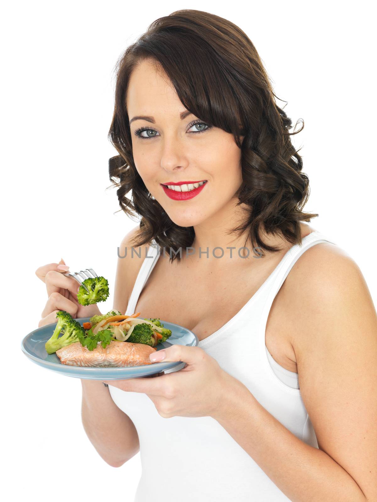 Healthy Young Woman Eating Salmon and Vegetables