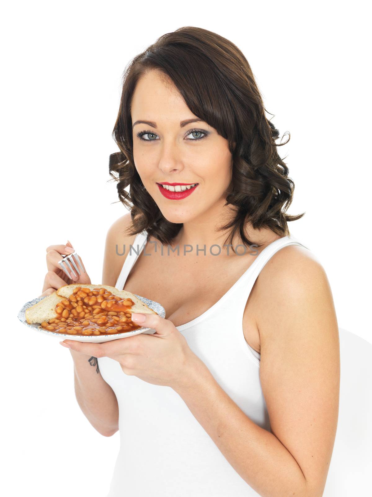 Young Woman Eating Baked Beans on Toast by Whiteboxmedia