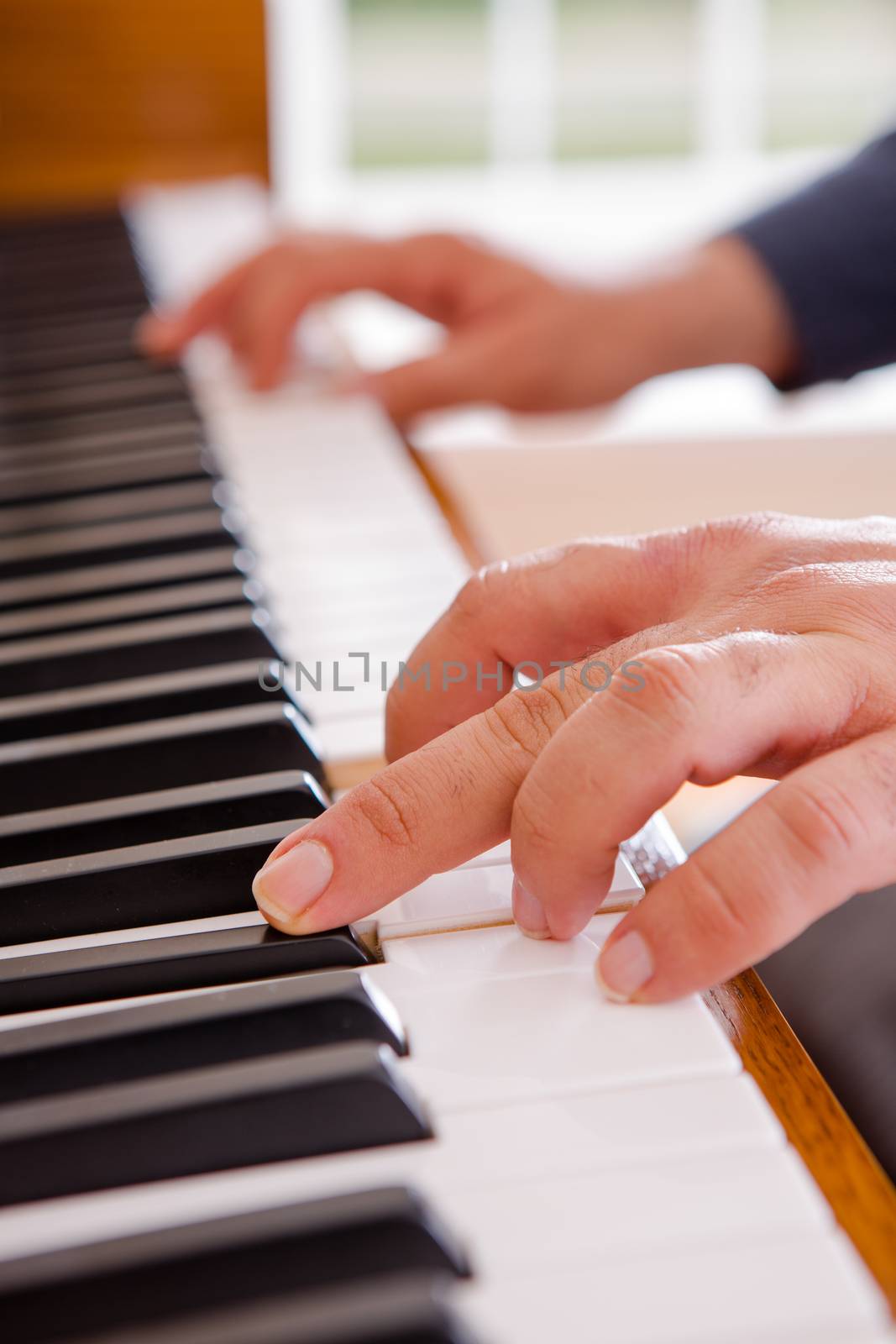 Man playing the piano by coskun