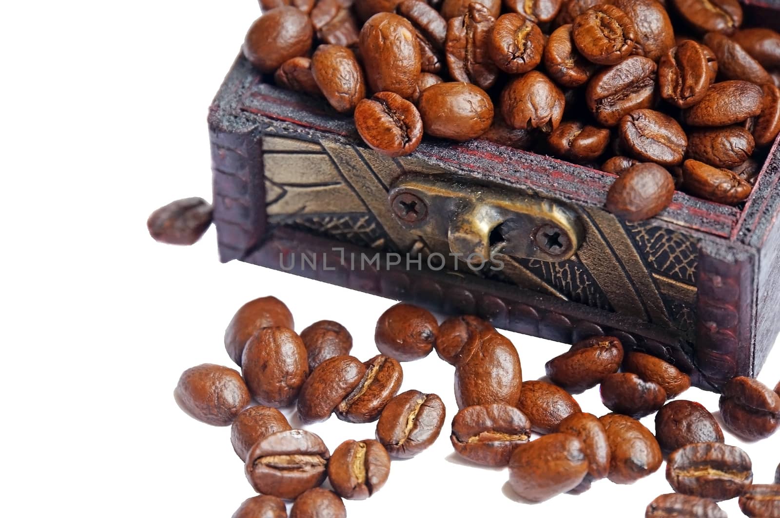 Vintage wooden box with coffee beans close up isolated by Chiffanna