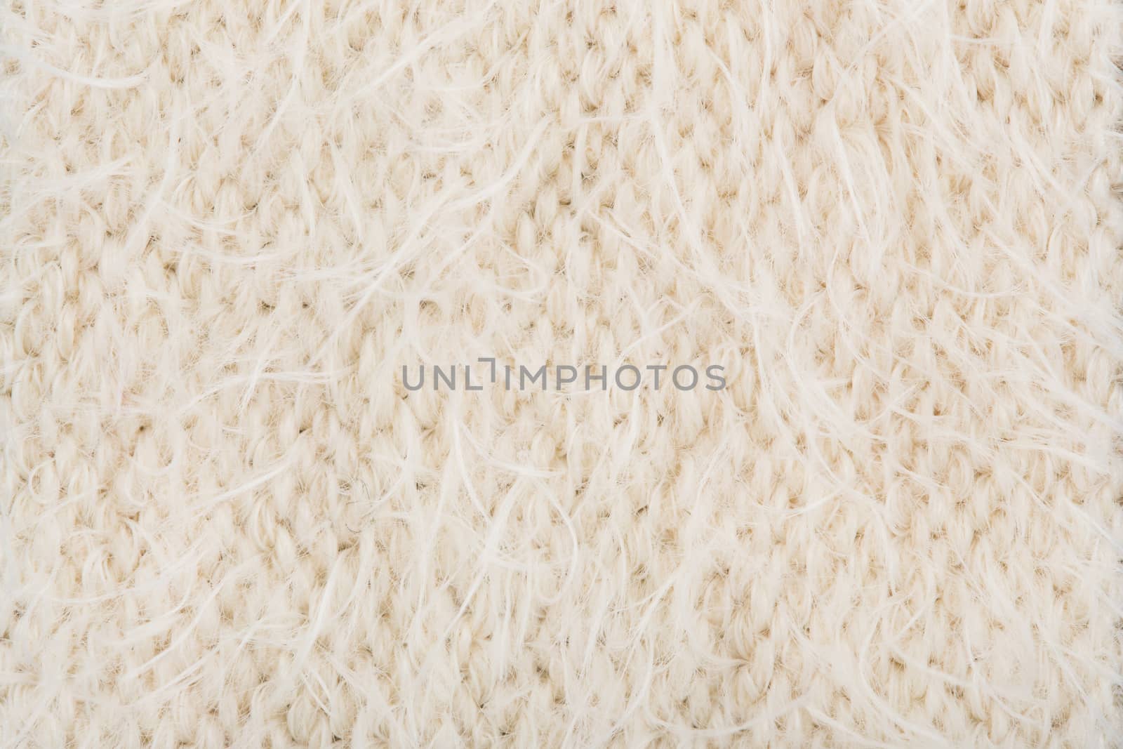 Cream knitting texture background by papound