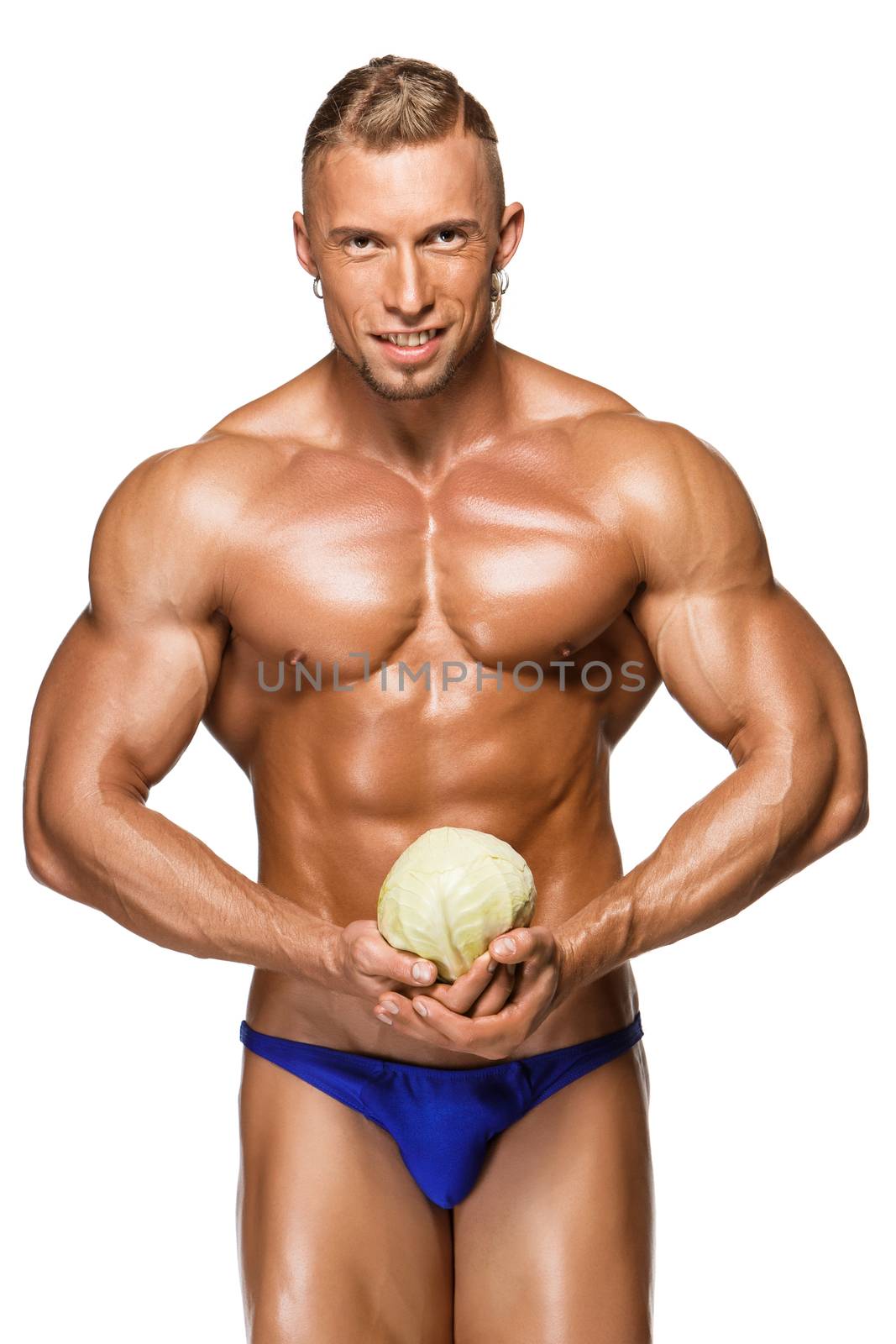 Shaped and healthy body man holding a fresh cabbage, isolated on white background