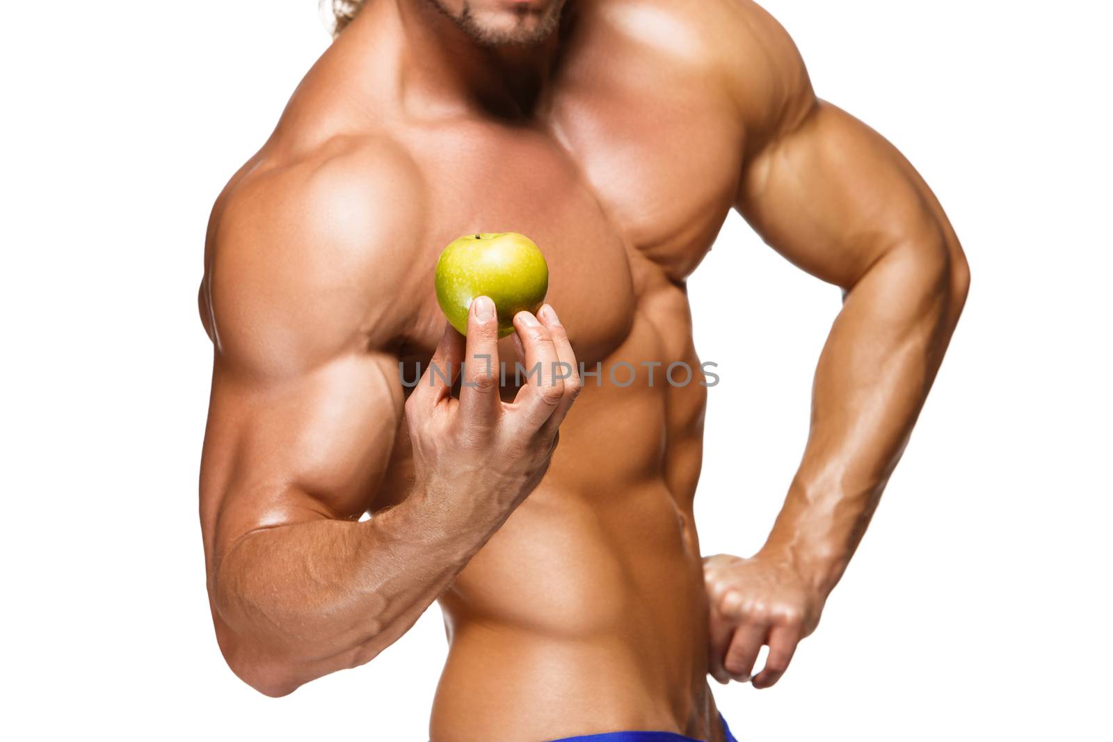 Shaped and healthy body man holding a fresh apple fruits, isolated on white background