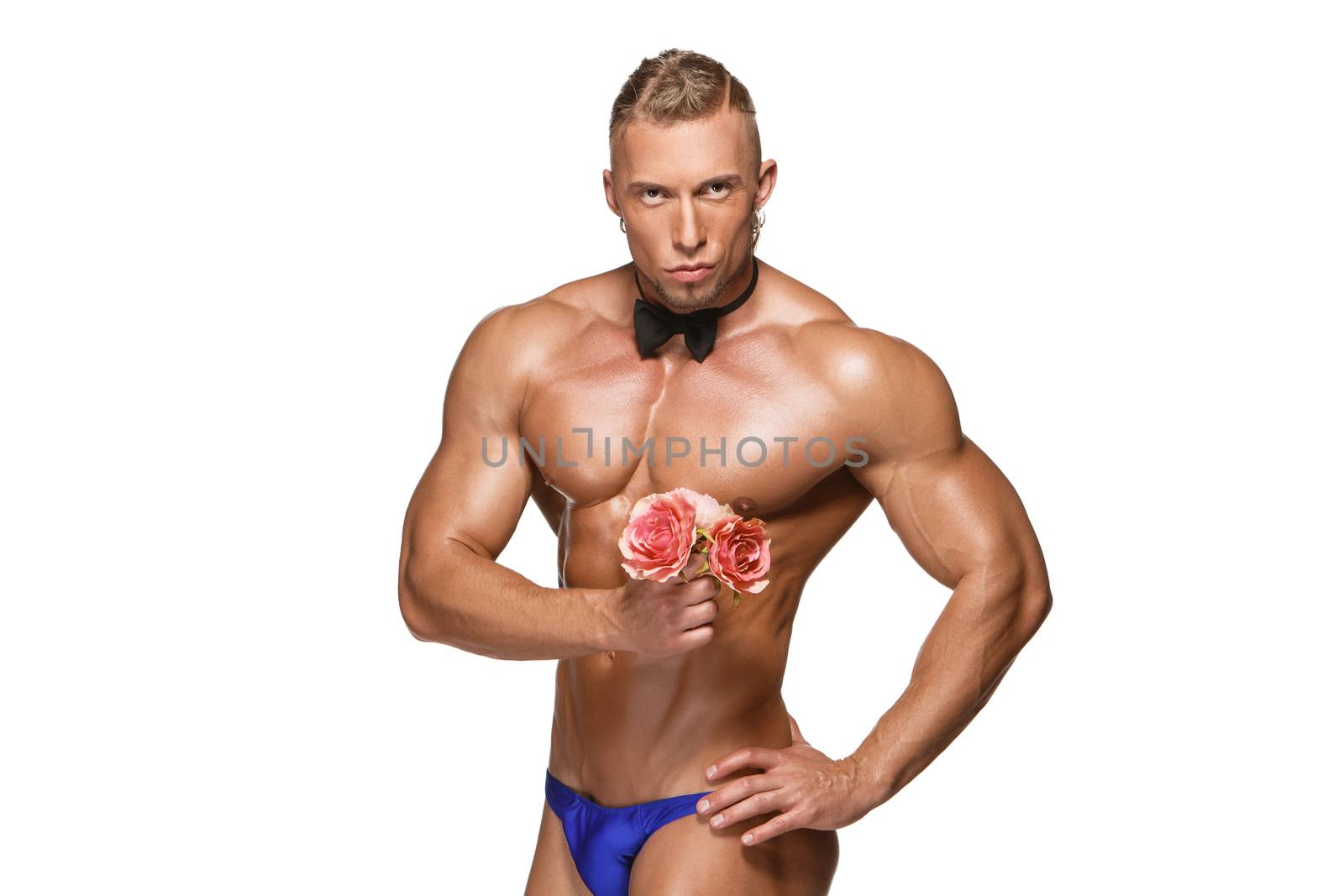 the very muscular handsome sexy guy  with butterfly and flowers on white background, naked  torso. the concept of a ladies' man