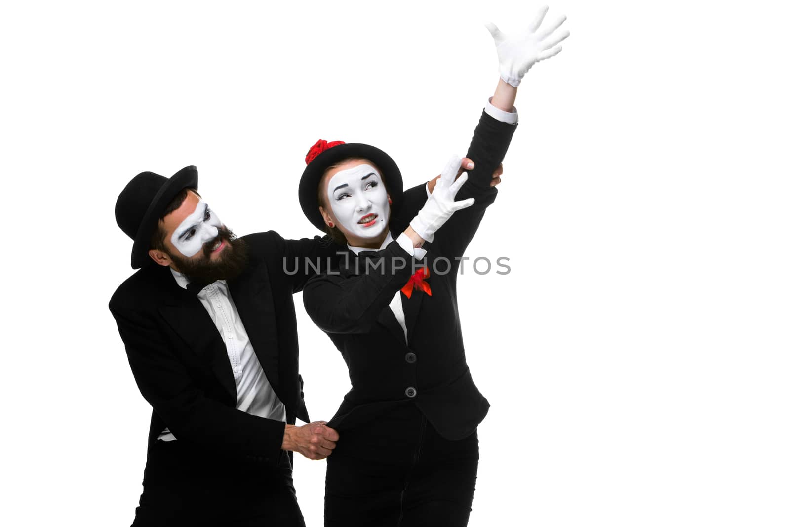 Mime holding another one up and running, isolated on white background. Concept of career and ambition of a businessman