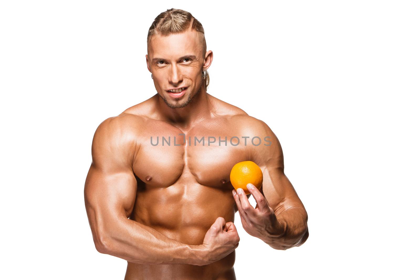 Shaped and healthy body man holding a fresh orange fruits, isolated on white background