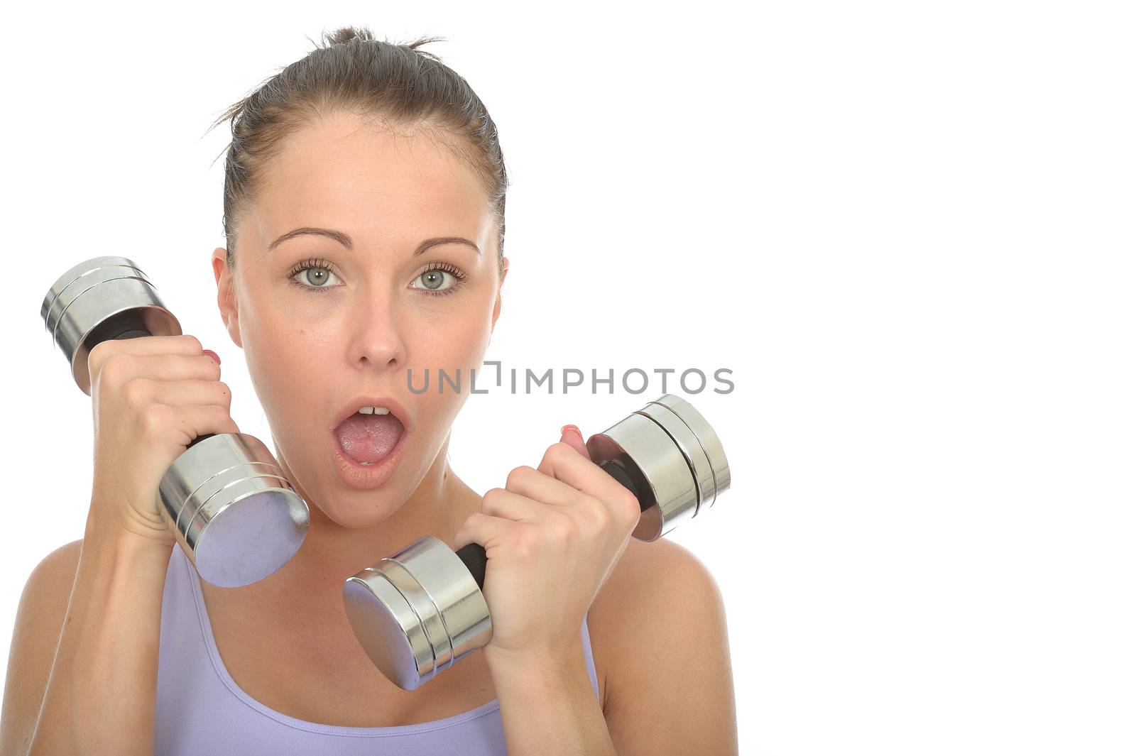 Healthy Young Woman Training With Weights Looking Shocked by Whiteboxmedia
