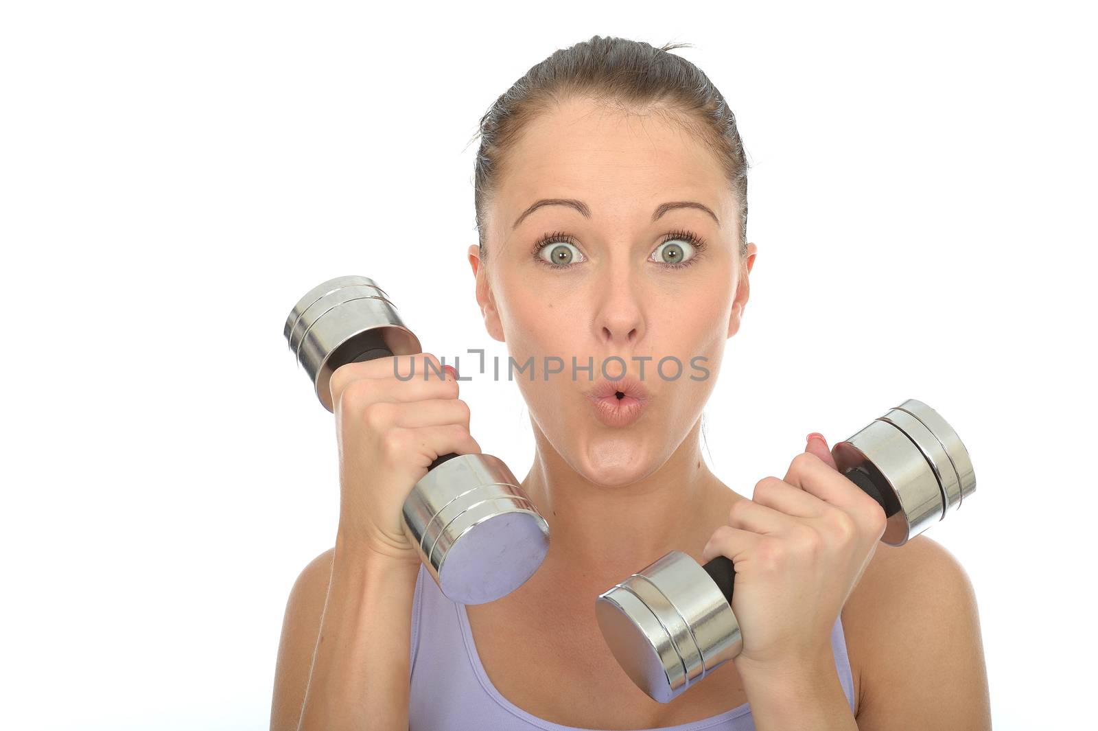 Healthy Young Woman Training With Weights Looking Shocked by Whiteboxmedia