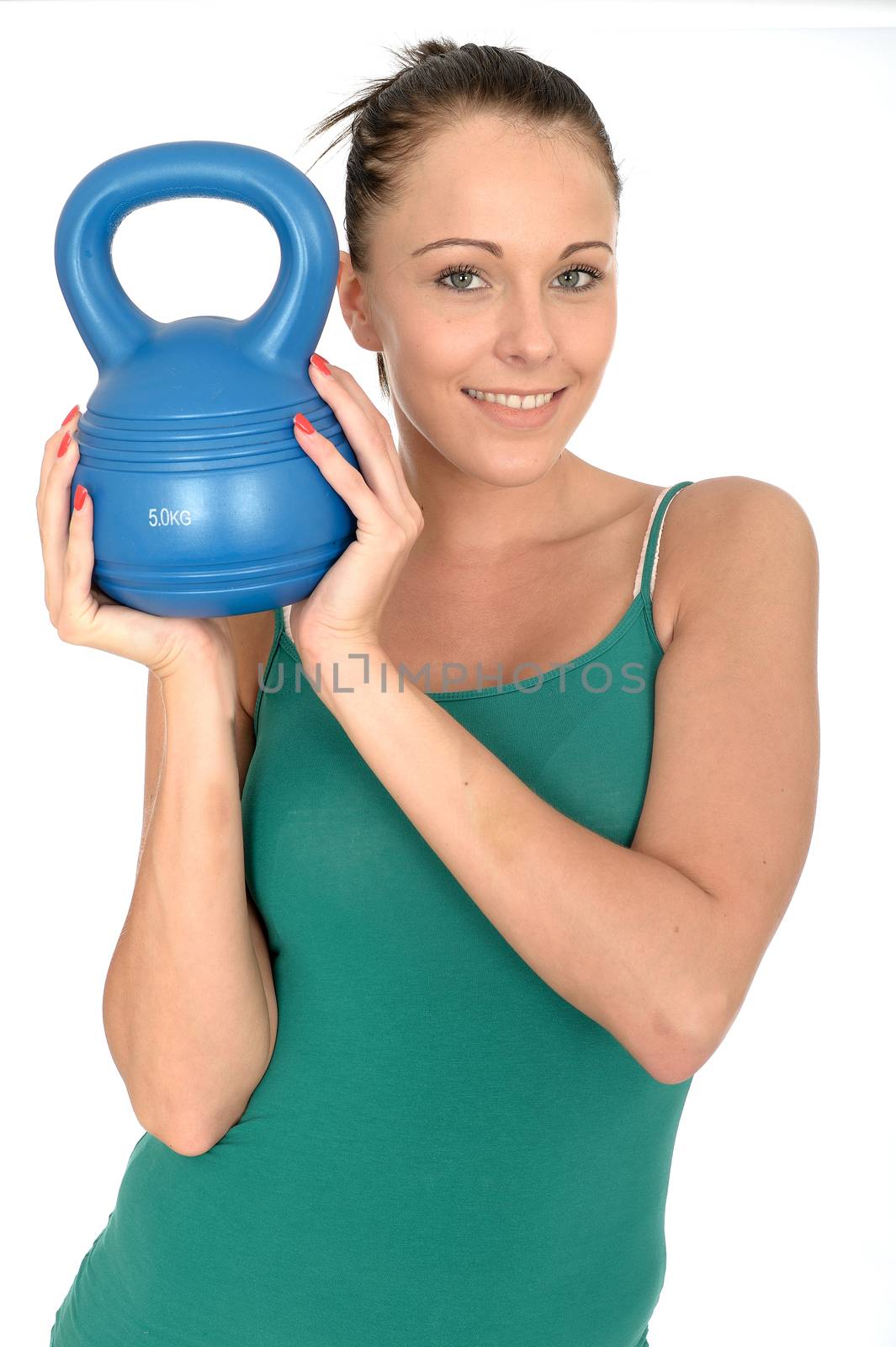Attractive Healthy Young Woman Working Out Lifting a 5kg Kettle Bell Weight