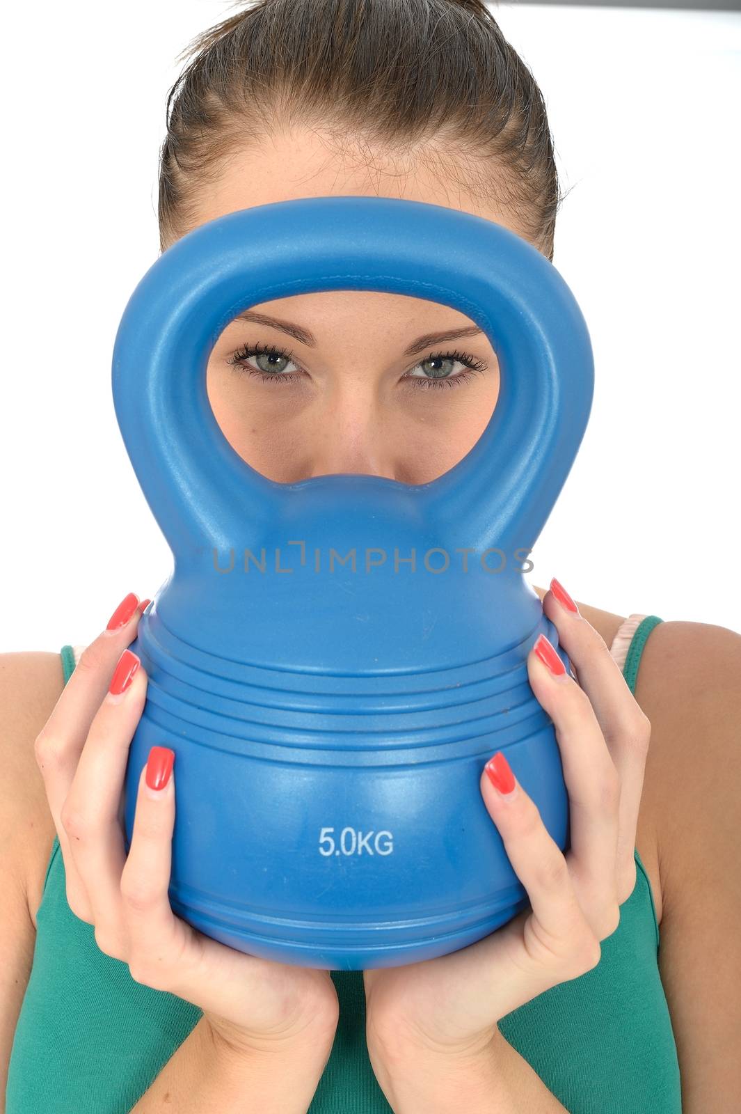 Close Up of a Young Woman Holding and Looking Through a 5kg Kettle Bell Weight