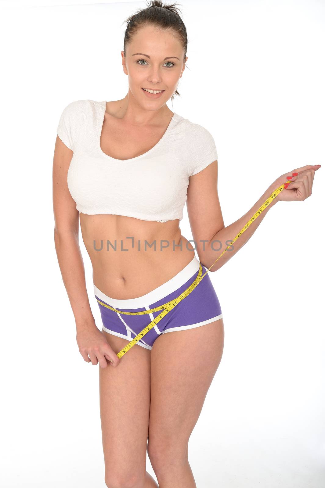 Healthy Fit Young Woman Checking Her Weight Loss With a Tape Measure