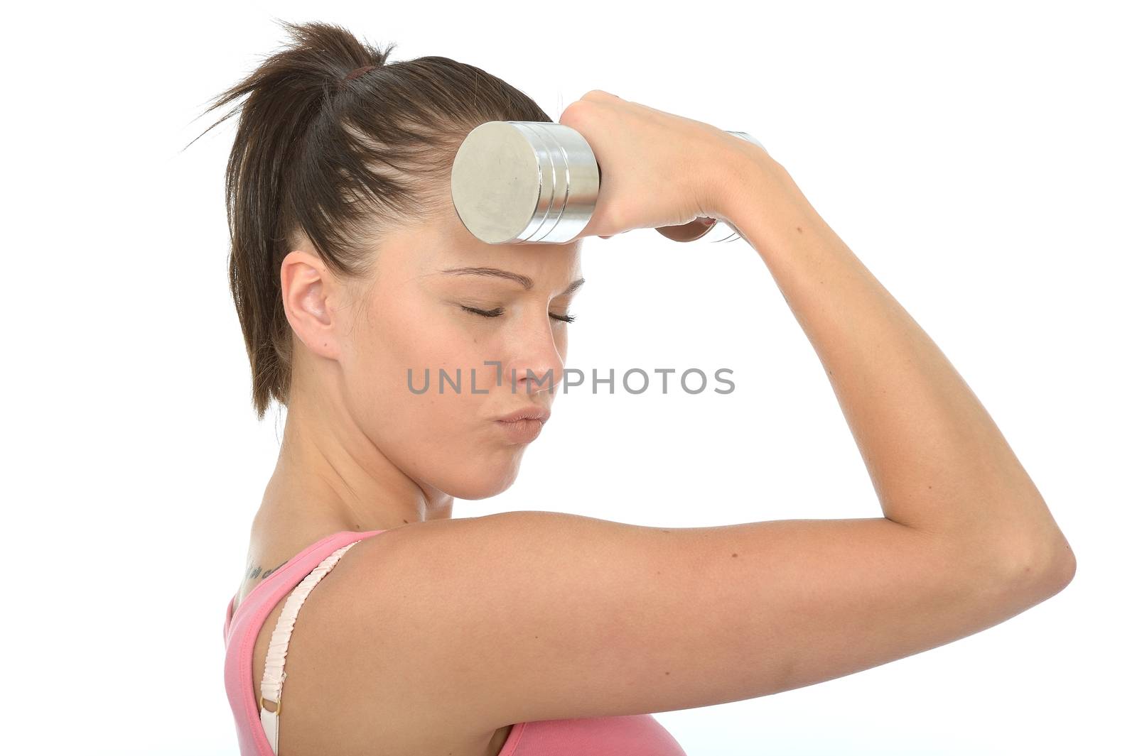 Healthy Young Woman Holding a Dumb Bell Weight to Her Forehead With Her Eyes Closed