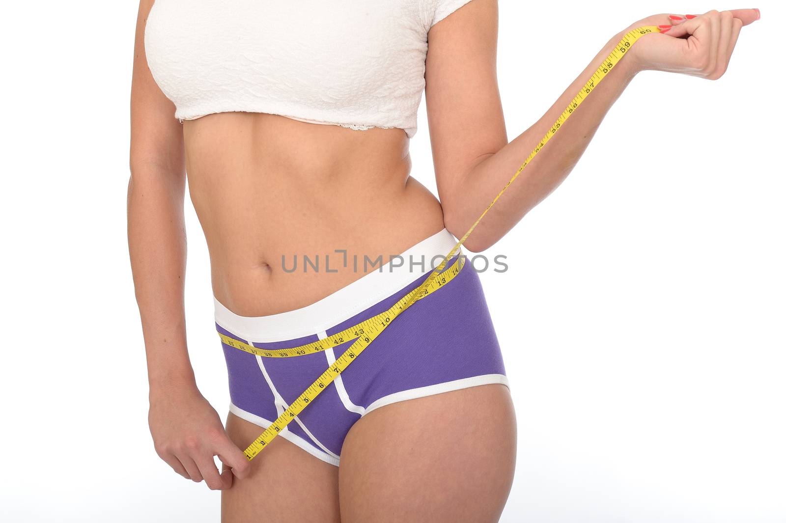 Healthy Young Woman Checking Her Weight Loss With a Tape Measure by Whiteboxmedia
