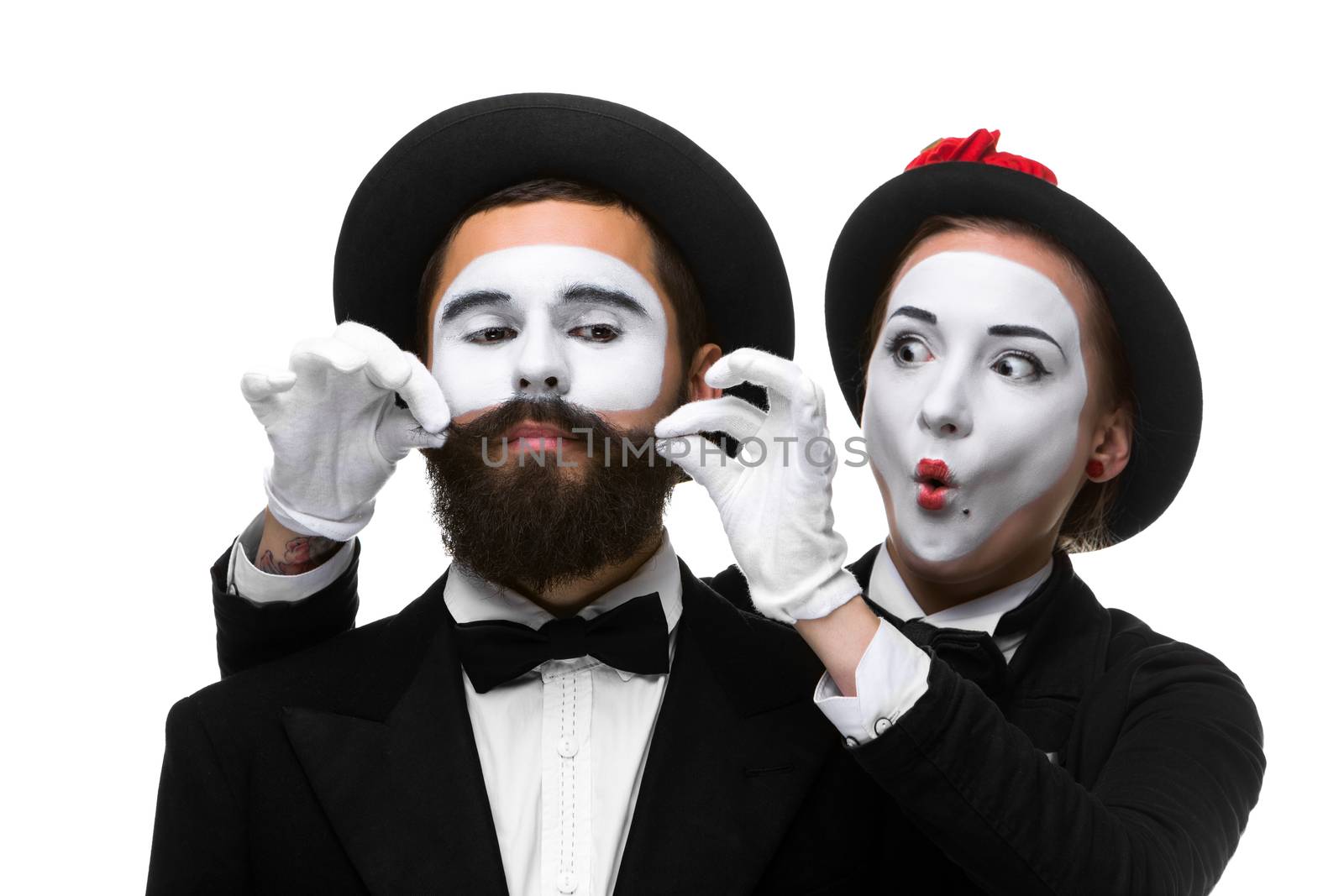 Two memes as businessmen. woman making a face man adjusting his mustache, isolated on a white background. Conceptual sense - the ability to keep a person