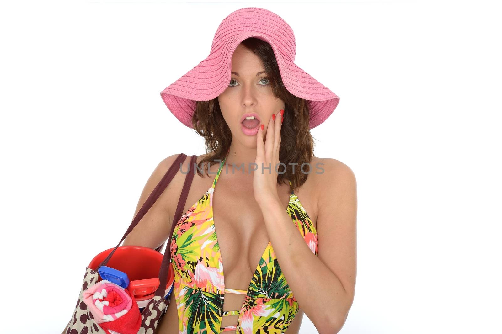 Young Woman Wearing a Swim Suit and a Pink Straw Hat on Holiday by Whiteboxmedia