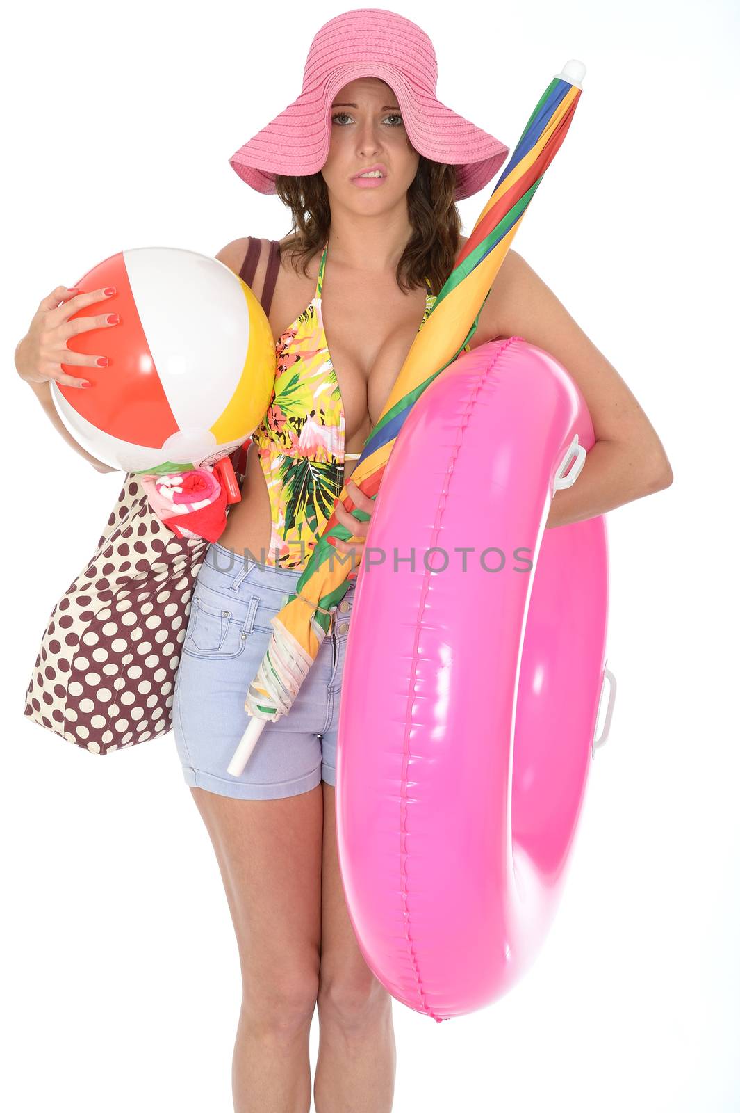Young Attractive Woman Wearing a Swim Suit on Holiday Carrying a Beach Ball Rubber Ring and Parasol