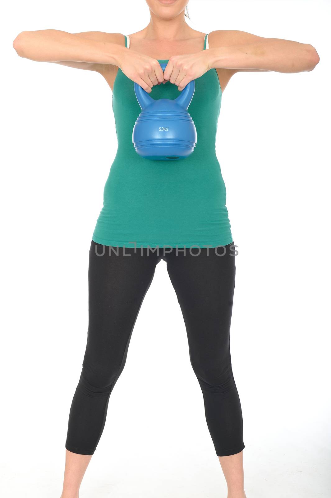 Attractive Healthy Young Woman Lifting a 5kg Kettle Bell Weight by Whiteboxmedia