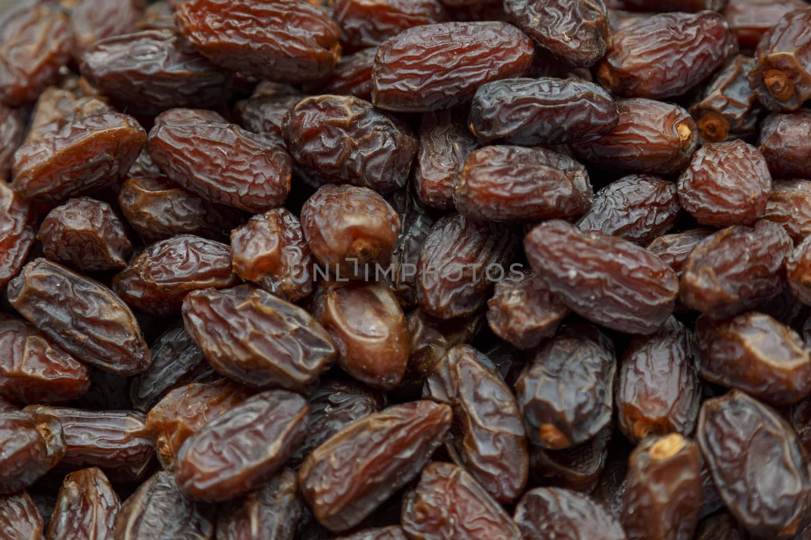 Fresh dried date fruits background in a market place