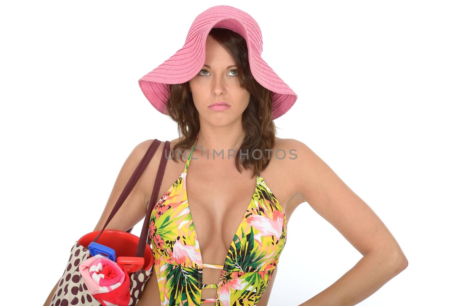 Young Woman Wearing a Swim Suit and a Pink Straw Hat on Holiday by Whiteboxmedia