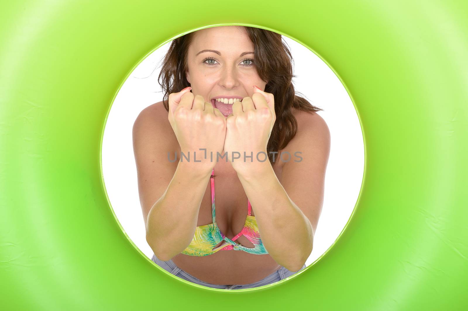Attractive Young Woman Looking Through a Green Rubber Ring by Whiteboxmedia