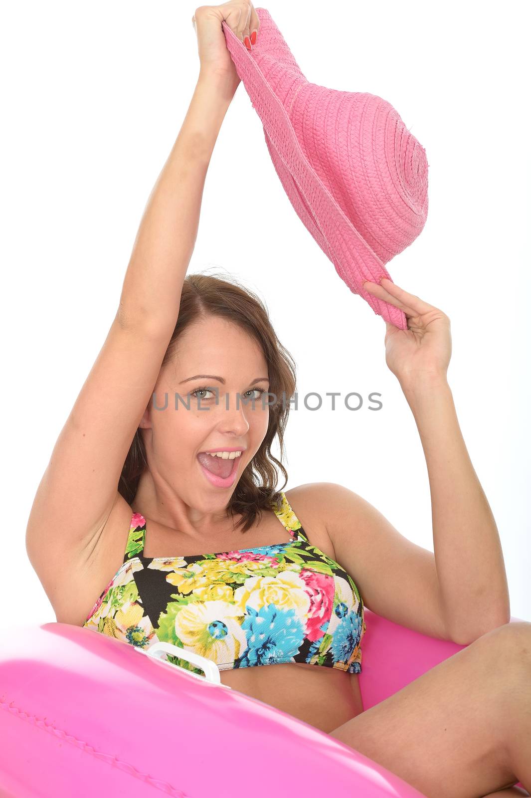 Attractive Young Woman Sitting in Rubber Rings Wearing a Swimsuit