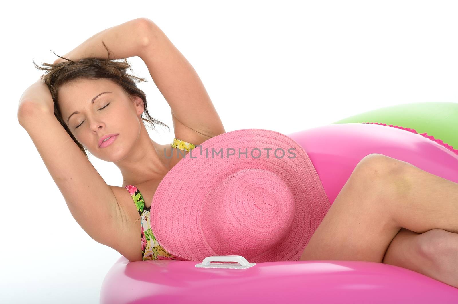 Attractive Young Woman Sitting in Rubber Rings Wearing a Swimsuit