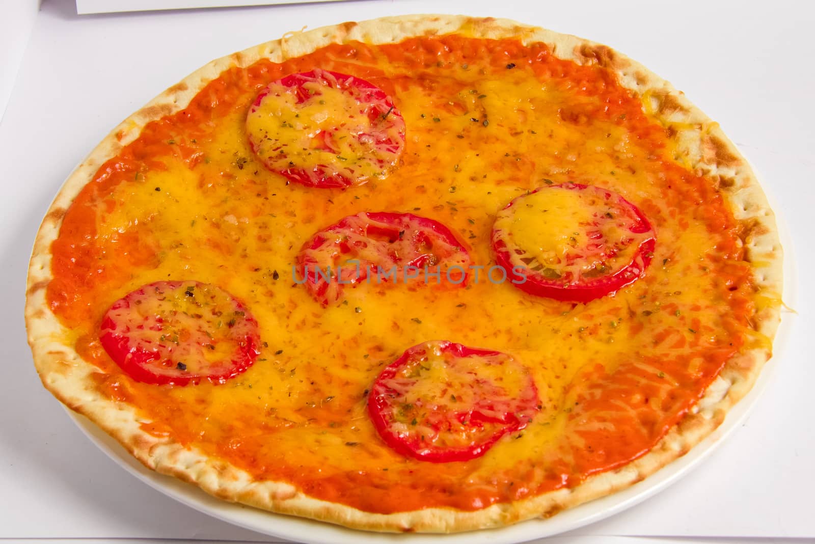 Pizza vegetarian with tomatoes and cheese