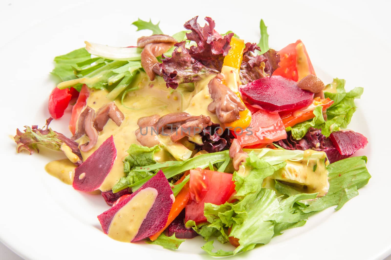 side dish with beets mushrooms sauce lettuce tomato paprika celery. On white background