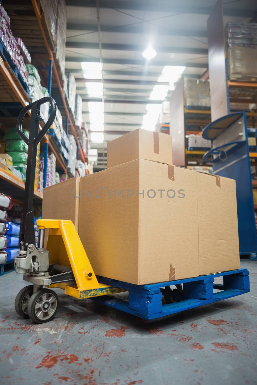 Cardboard boxes on trolley in warehouse