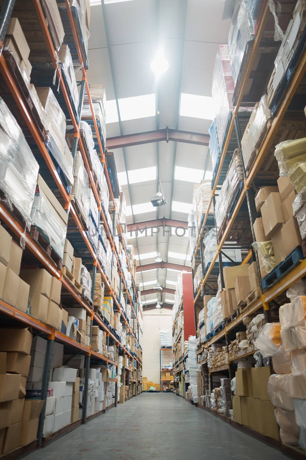 Rows of shelves with boxes in warehouse