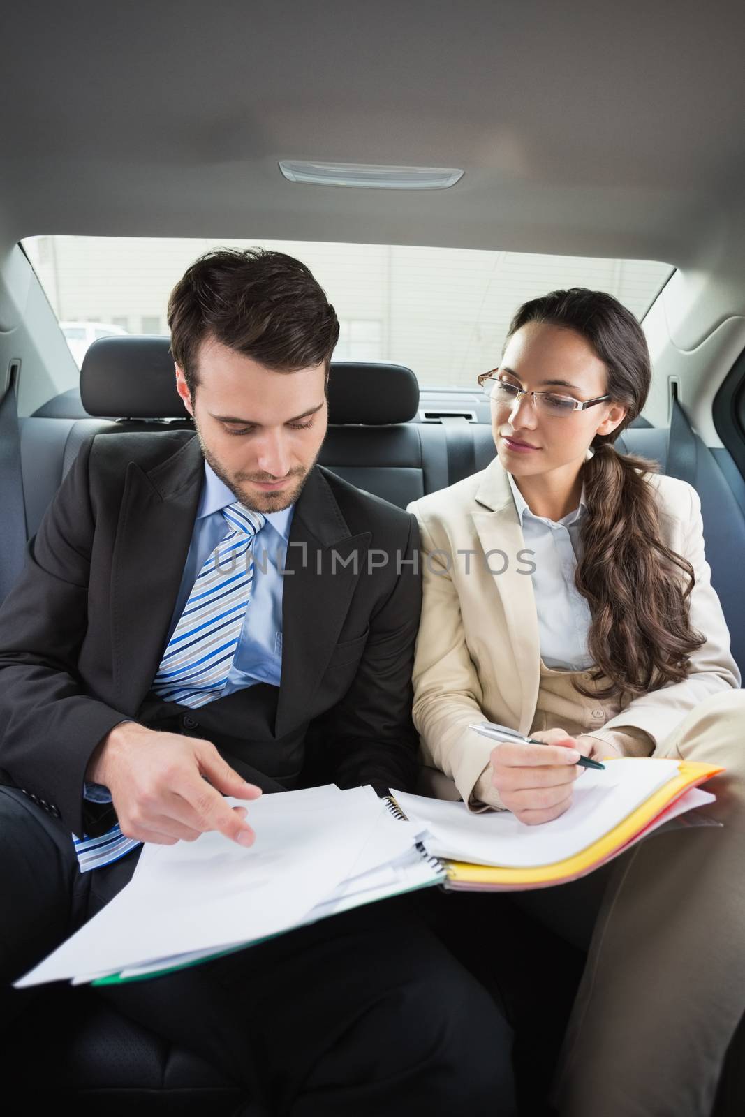 Young business team working together in the car