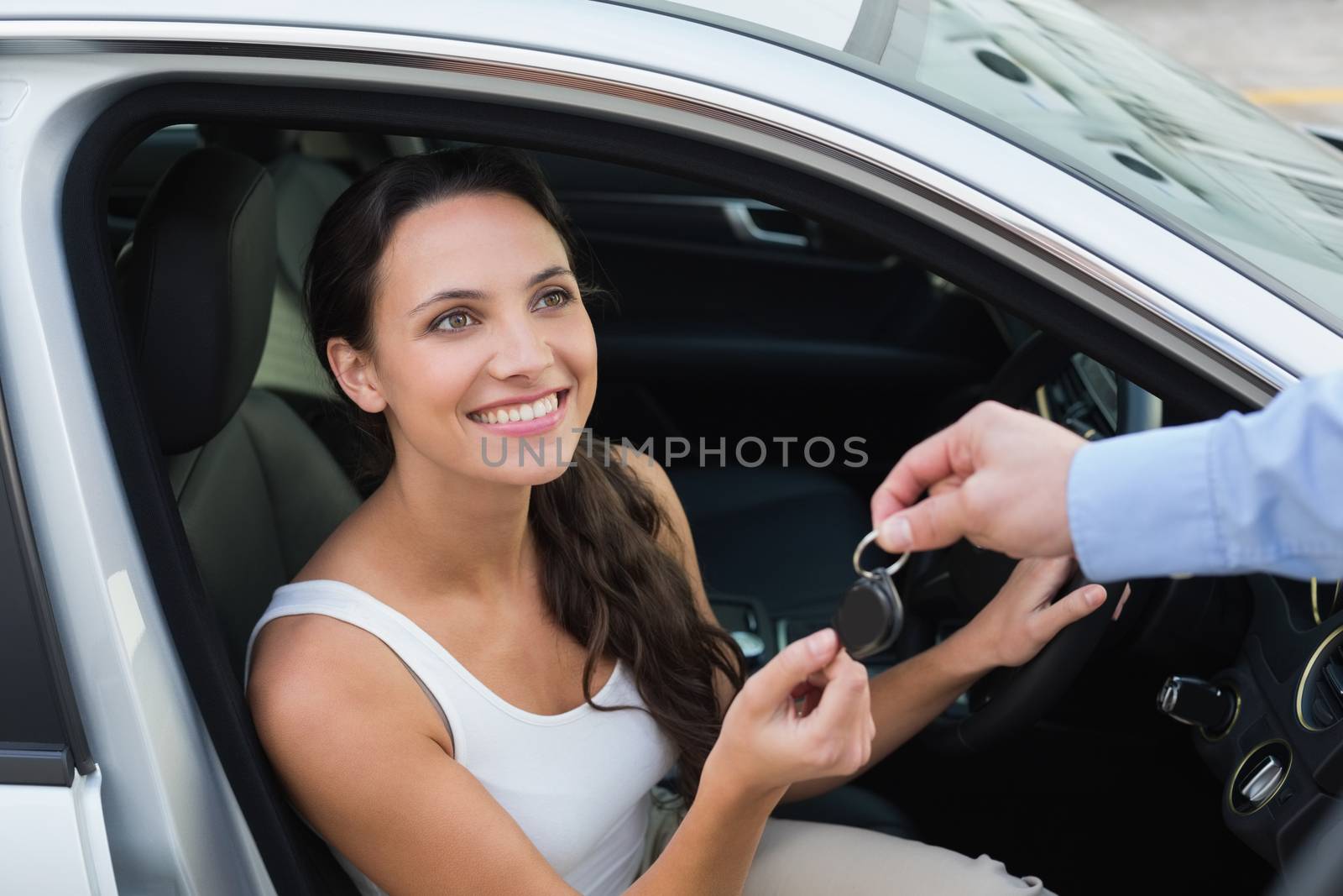 Young woman getting her key by Wavebreakmedia