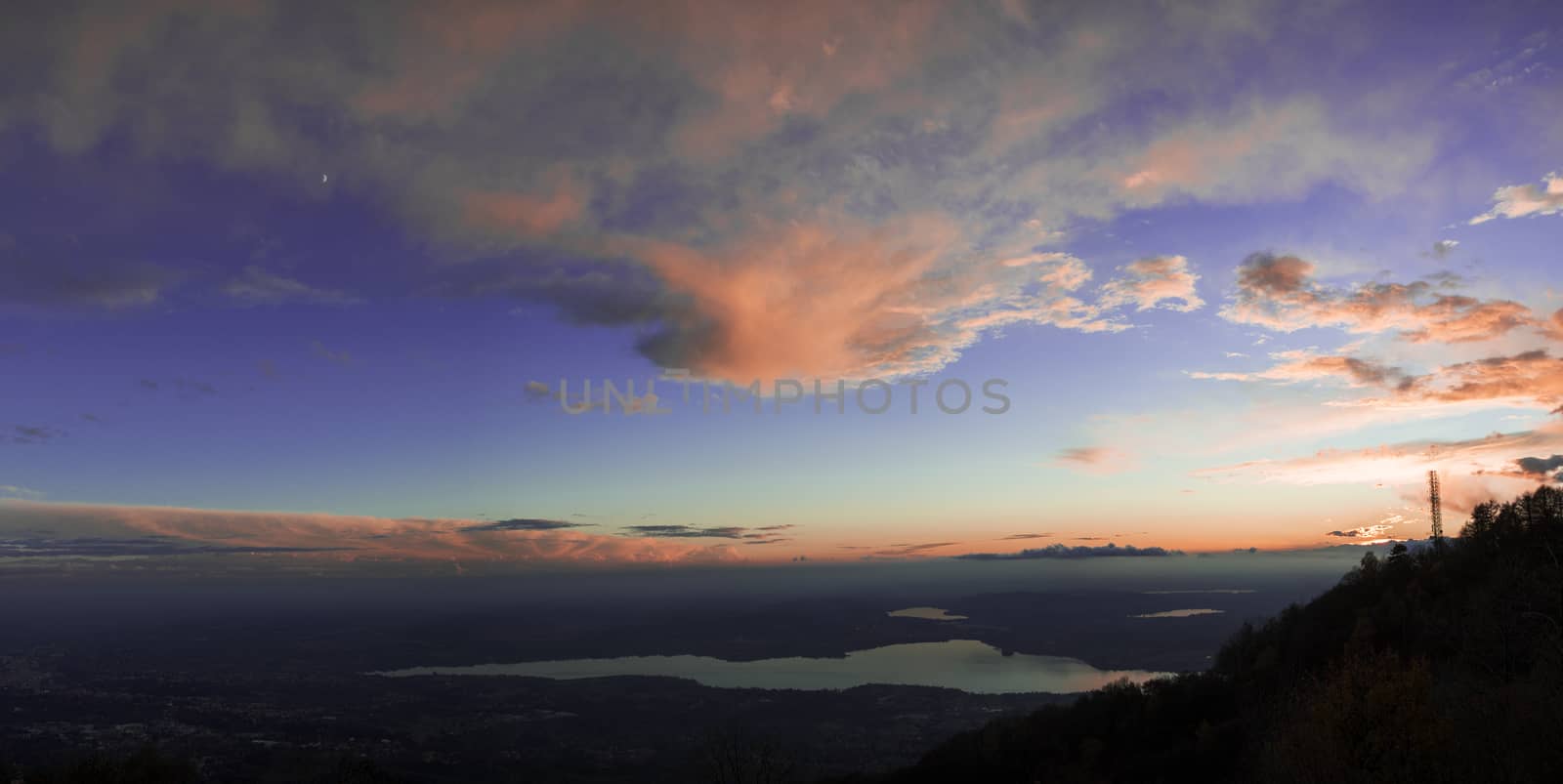 Colorful sunset on the Varese lake in a autumn afternoon vier from regional park of Campo dei Fiori Varese - Lombardy, Italy