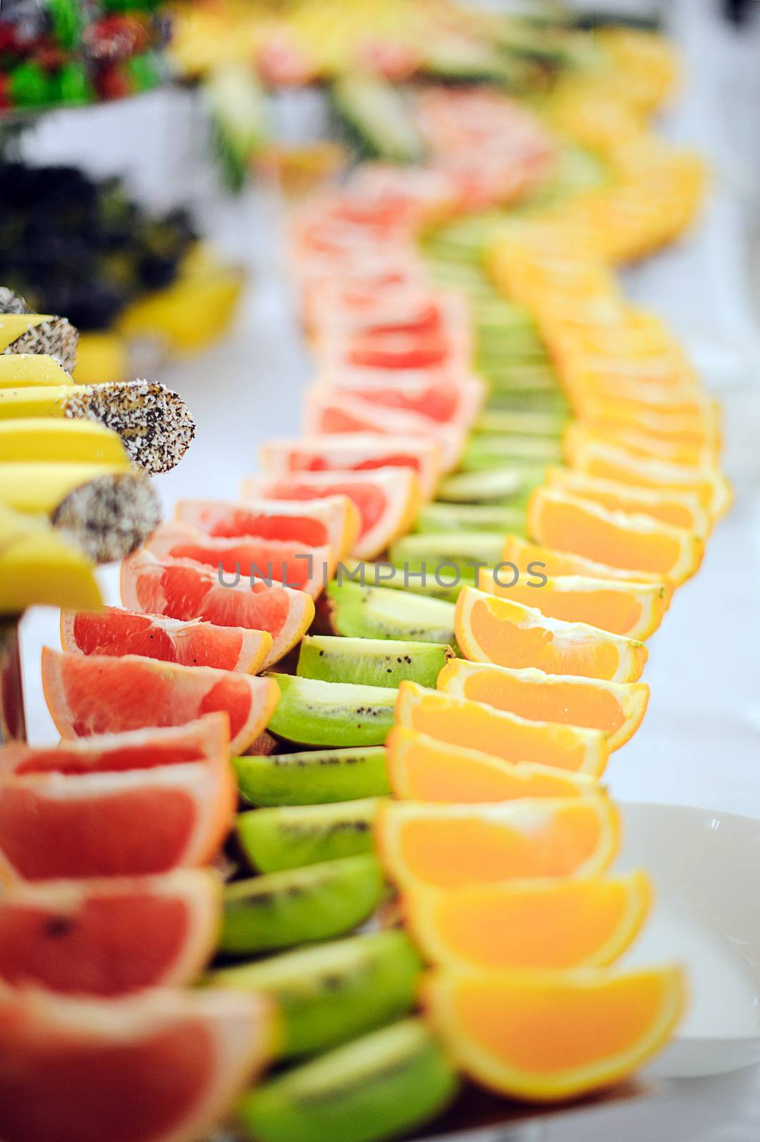 Grapefruit, kiwi and orange on the table