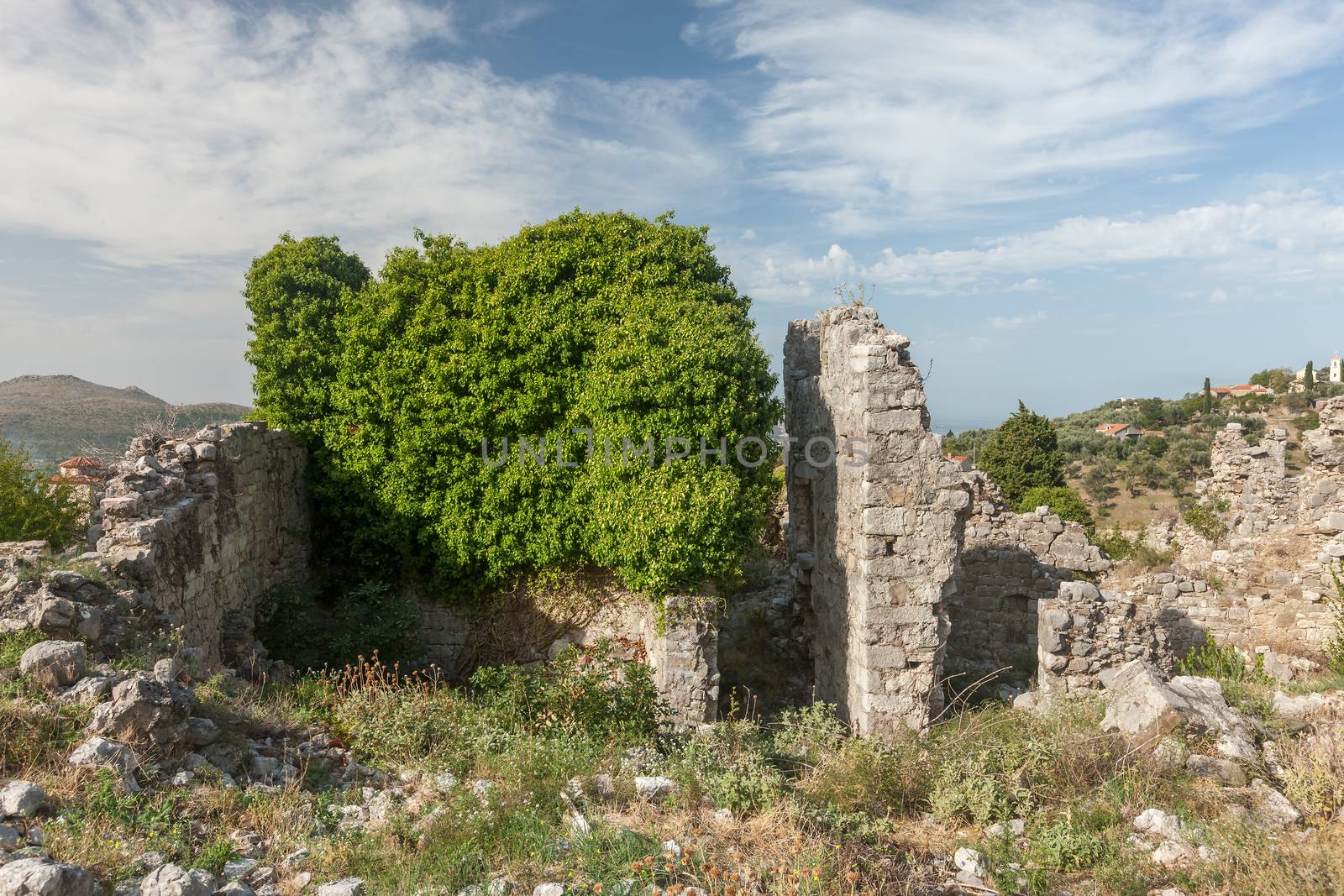 The high fortress walls with the scenic mountains on the background, Stari Bar, Montenegro.