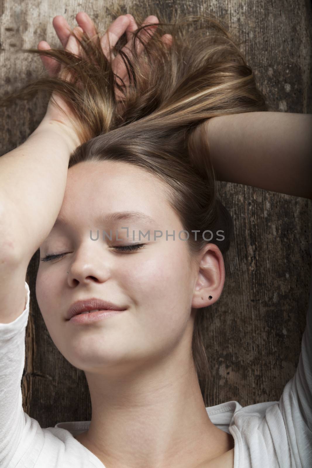 young woman dreaming on a plank