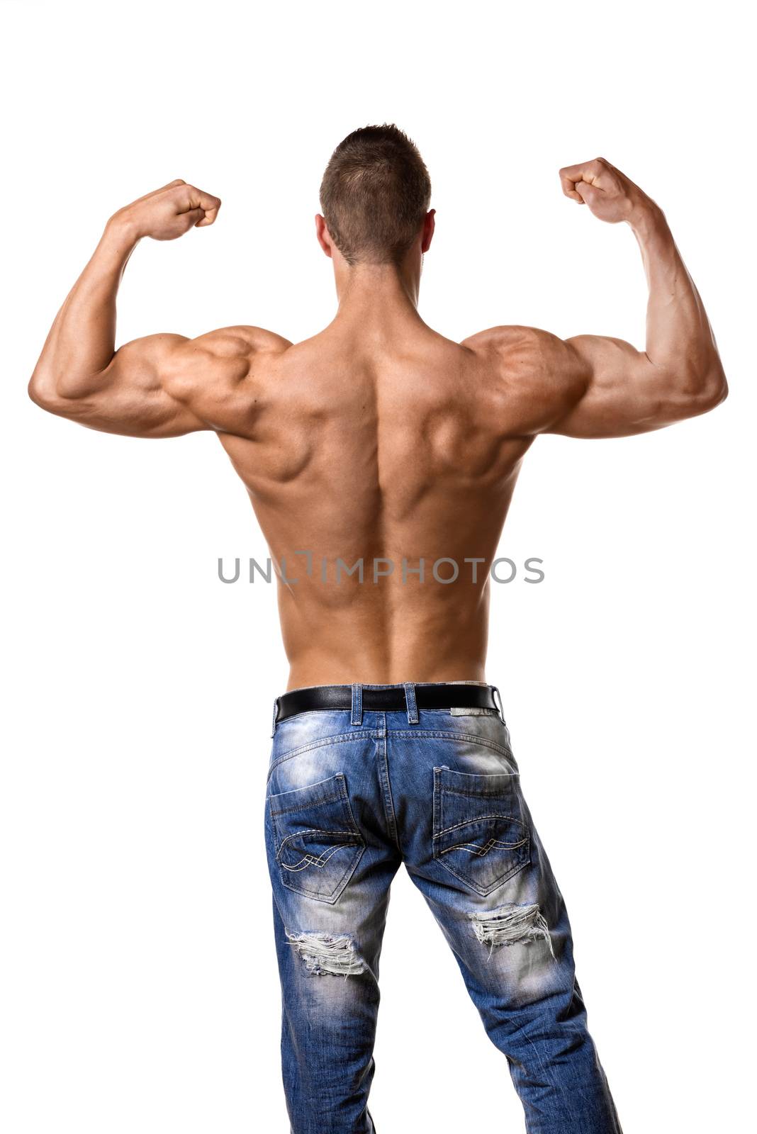 Back of a young man with well trained body, triceps, lats and rhomboid muscle and wearing a denim trousers