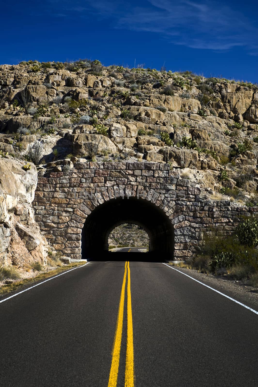 Image of a highway heading into a tunnel