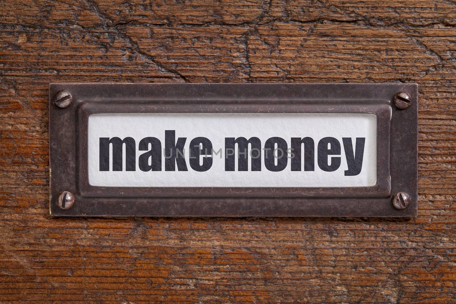 make money  - file cabinet label, bronze holder against grunge and scratched wood