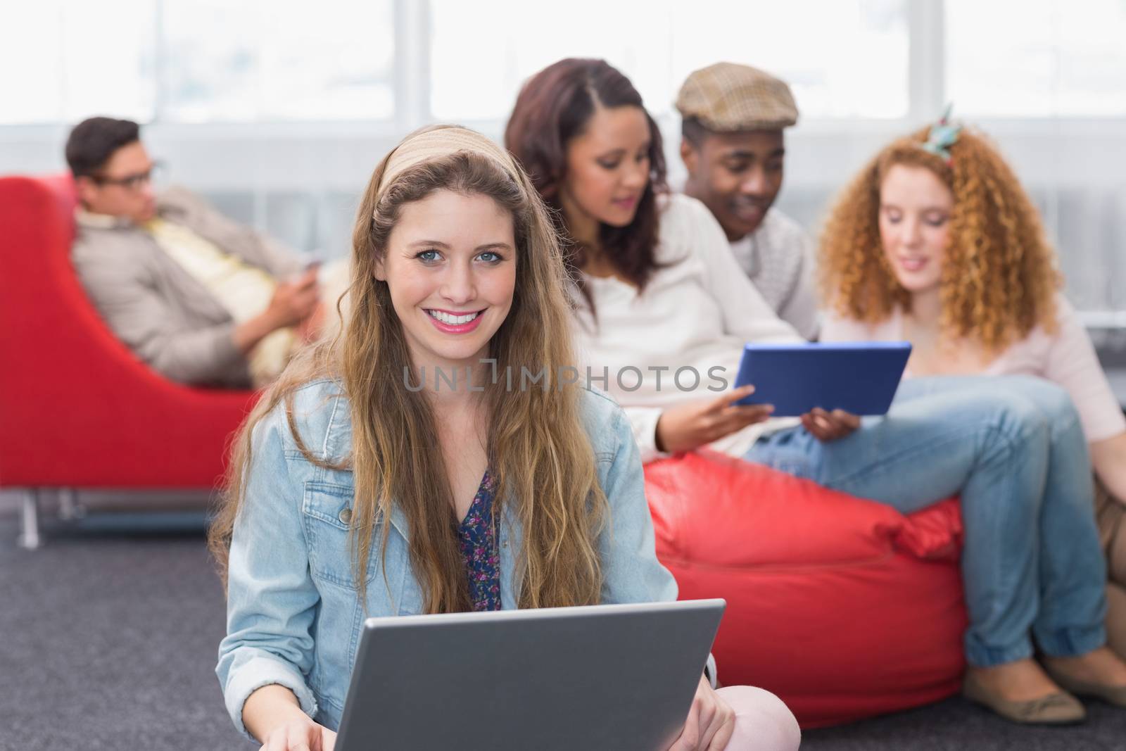 Fashion student using her laptop by Wavebreakmedia