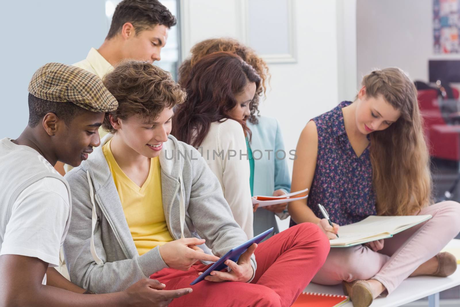 Fashion students reading their notes by Wavebreakmedia