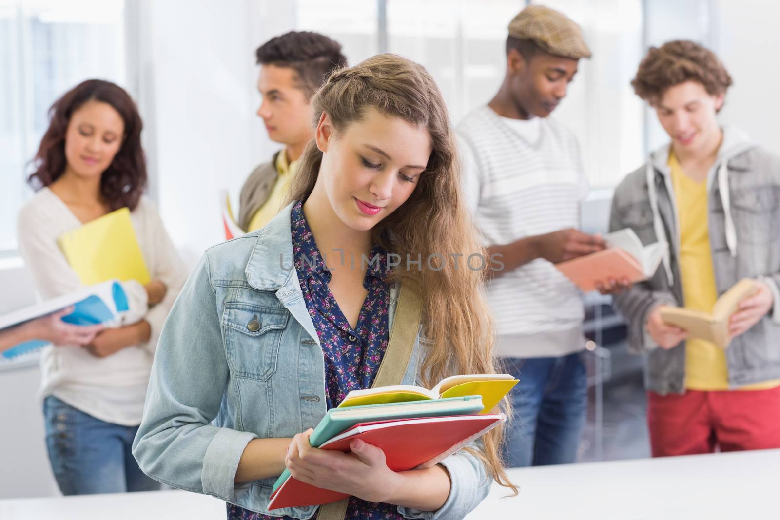 Fashion student reading her notes at the college