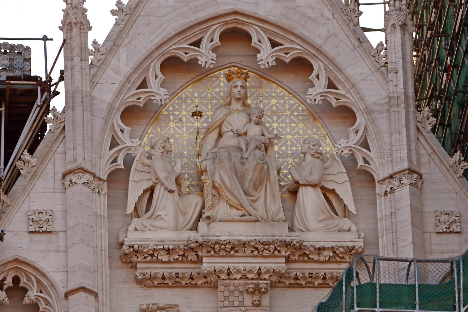Tympanum of the Cathedral of Assumption of the Blessed Virgin Mary in Zagreb, Croatia decorated with statues of the Virgin Mary, Jesus and angels