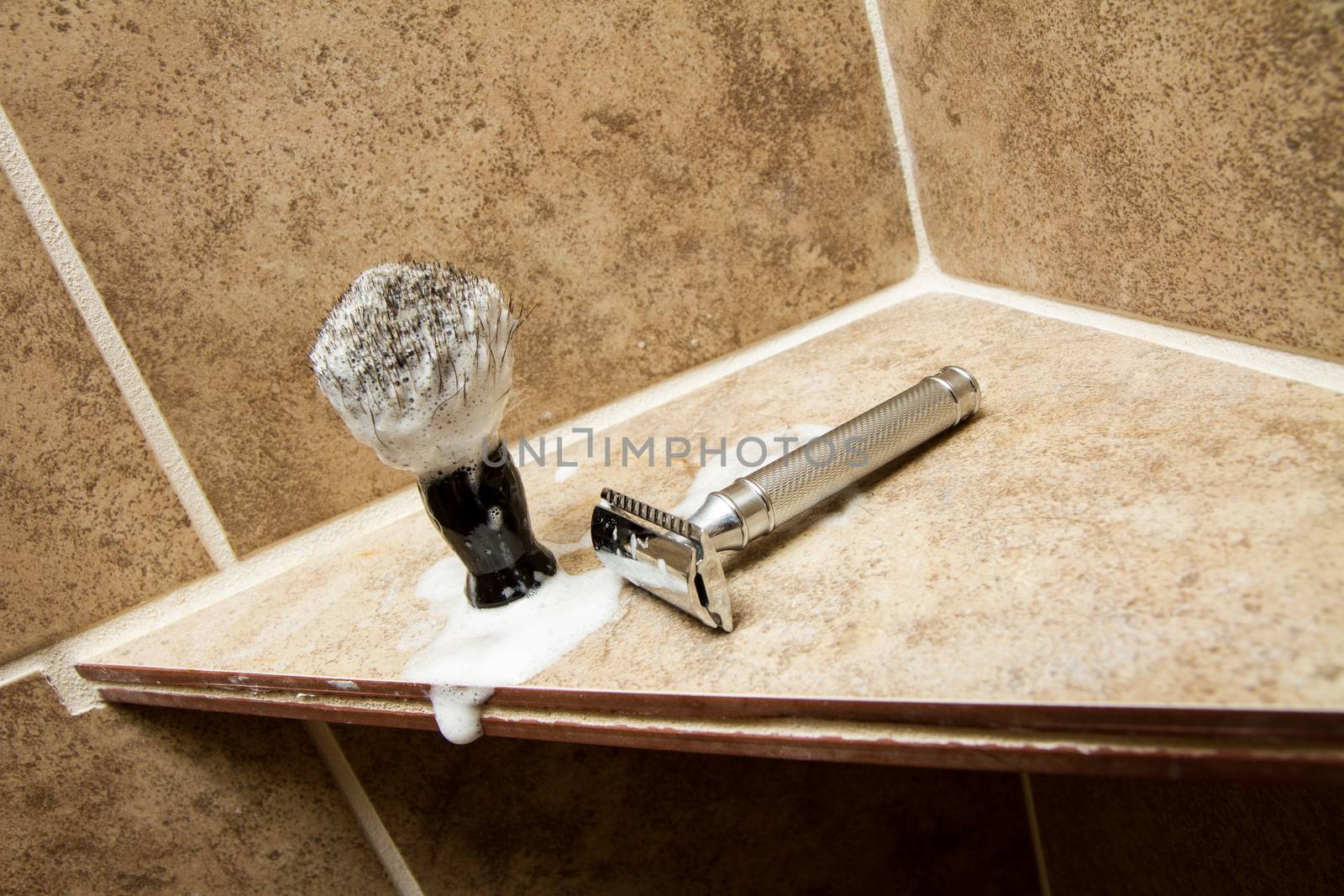 Old fasion safety razor and shaving brush in the bathroom